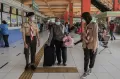 Begini Aksi Anggota Pramuka Bantu Amankan Arus Mudik di Terminal Kampung Rambutan