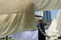 Melihat Tradisi Jemaah Haji Asal China, Mencuci Kain Kafan dengan Air Zamzam