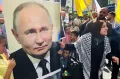 Demo Kutuk Israel, Warga Hebron Bawa Poster Kim Jong Un dan Putin