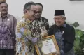 OJK Raih Anugerah Keterbukaan Informasi Publik