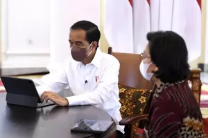 Potret Jokowi Lapor SPT Pajak Tahunan secara Daring Sambil Diliatin Sri Mulyani